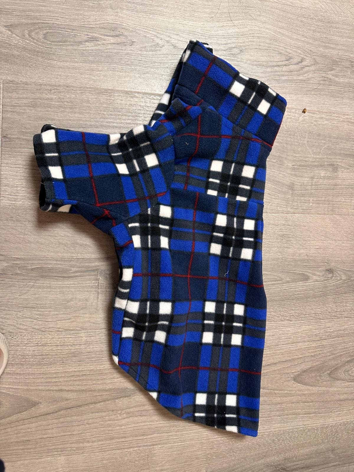 Keep your dog warm stylish in this handmade royal blue plaid fleece jacket! Features a fold-over collar, sleeves easy Velcro front.