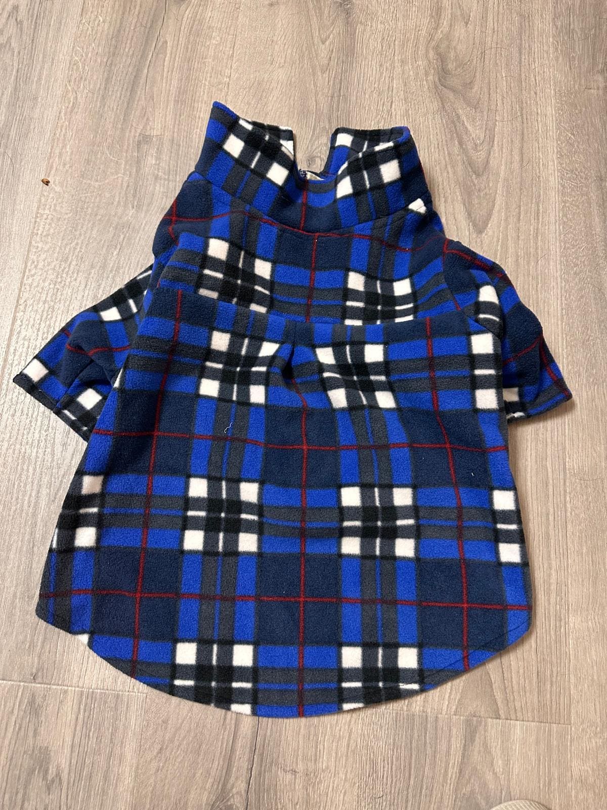 Keep your dog warm stylish in this handmade royal blue plaid fleece jacket! Features a fold-over collar, sleeves easy Velcro front.