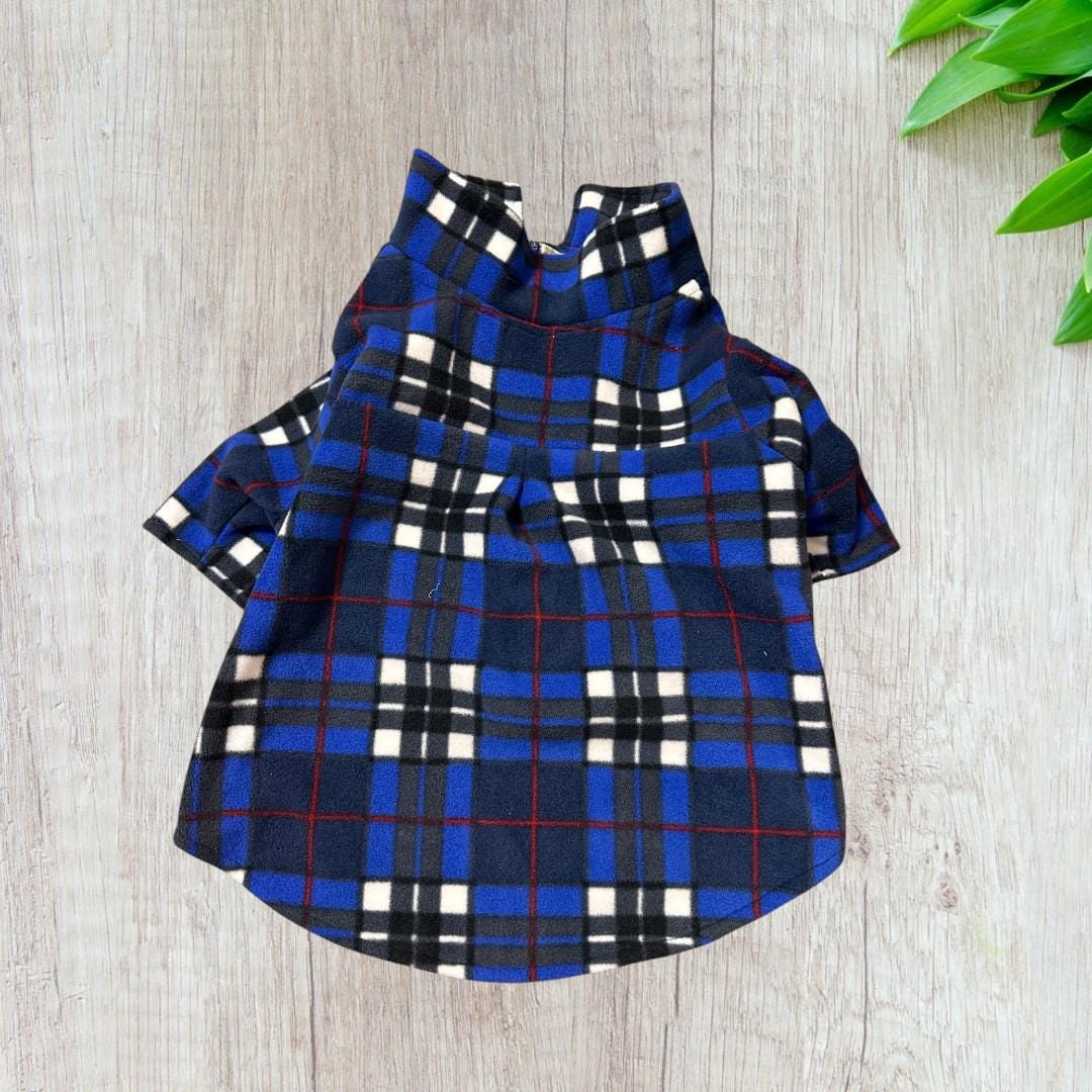 Keep your dog warm stylish in this handmade royal blue plaid fleece jacket! Features a fold-over collar, sleeves easy Velcro front.